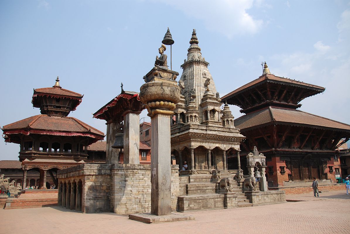 Kathmandu Bhaktapur 02-1 Bhaktapur Durbar Square Teleju Bell, King Bhupatindra Malla Column, And Vatsala Durga Temple In front of the Royal Palace in Bhaktapur�s Durbar Square are the large Teleju Bell (1737), King Bhupatindra Malla�s column (1699), and the shikhara-style stone Vatsala Durga Temple (1672). Much of Bernardo Bertolucci�s movie Little Buddha was filmed near the Vatsala Temple. On the left is Chyasilin Mandapam, an octagonal temple rebuilt in 1990 after it was destroyed by fire in 1934.